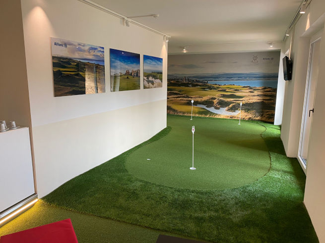 Greenwich indoor putting green in an office with scenic wall art